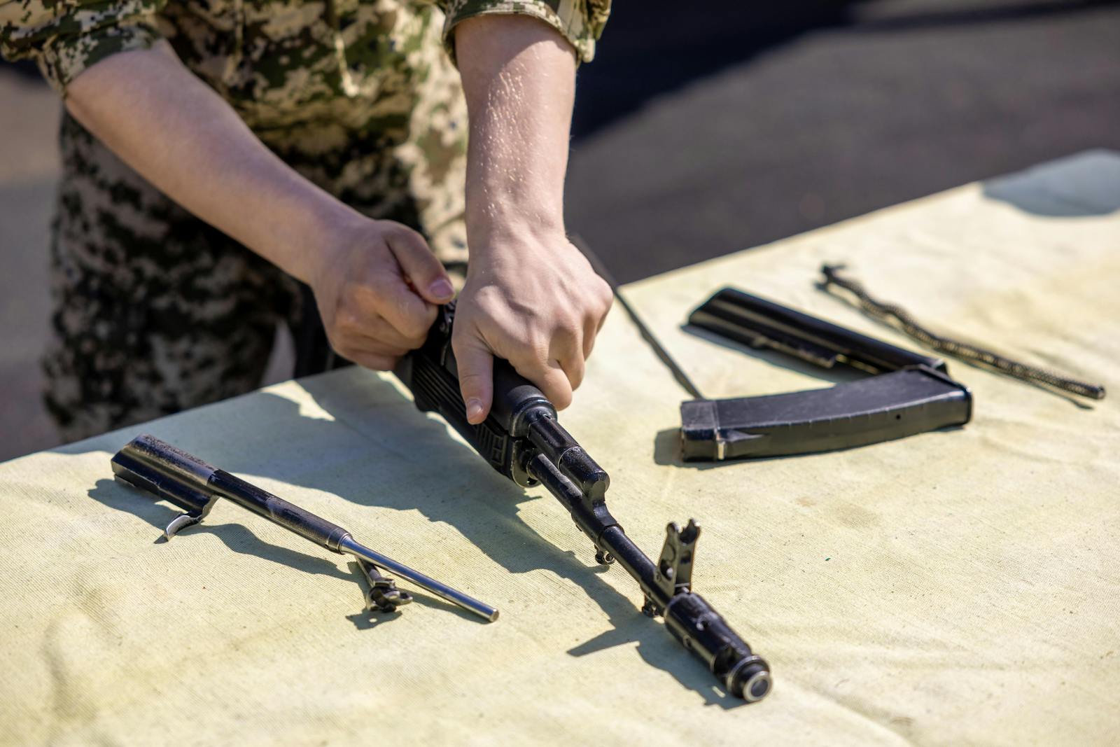 Gunsmith assembling rifle